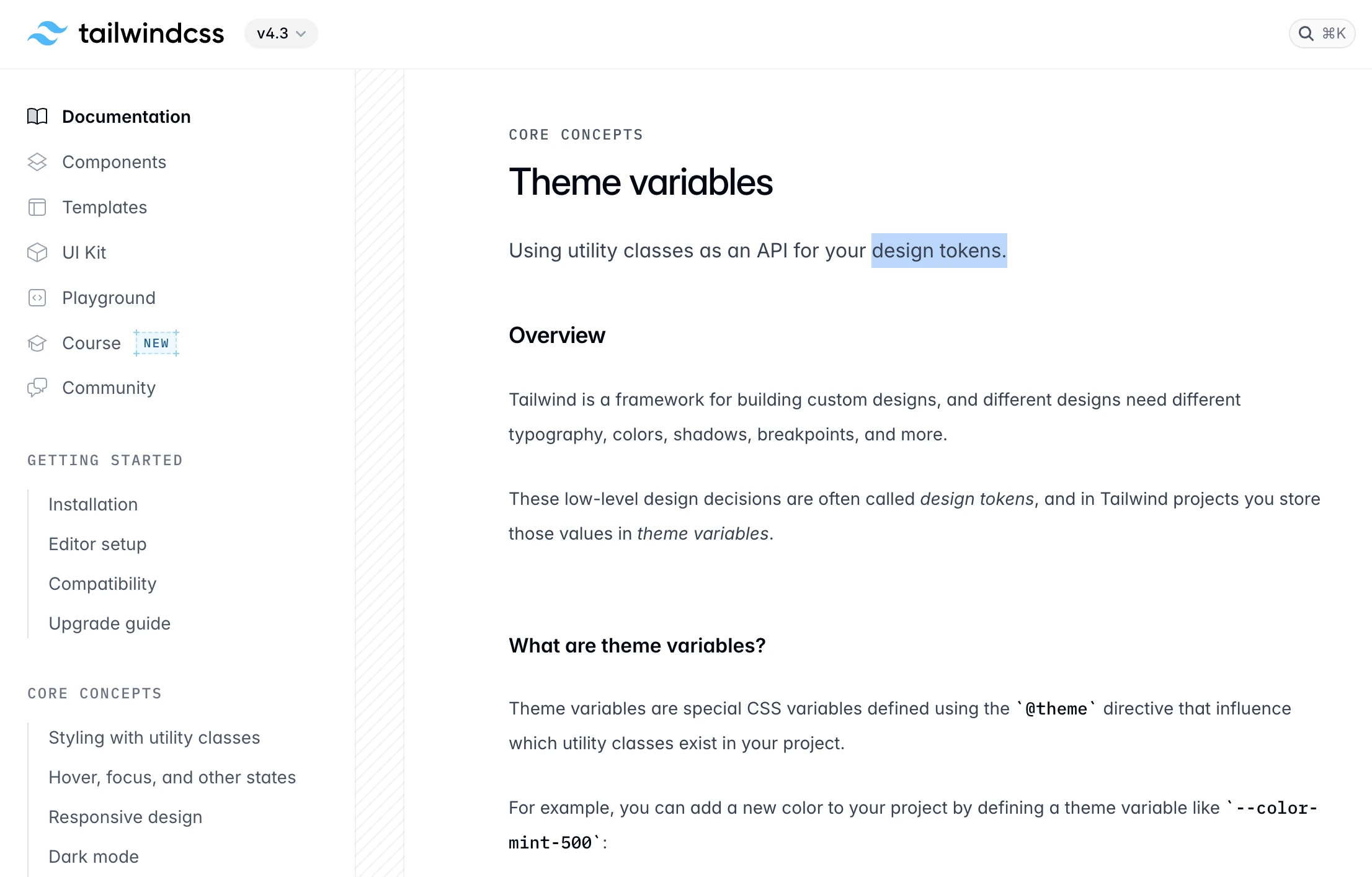 Tailwind's v4 theme documentation, with the sentence describing low-level design decisions as design tokens stored in theme variables.